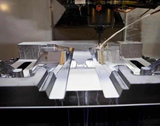 The pouring process of metal mold casting.